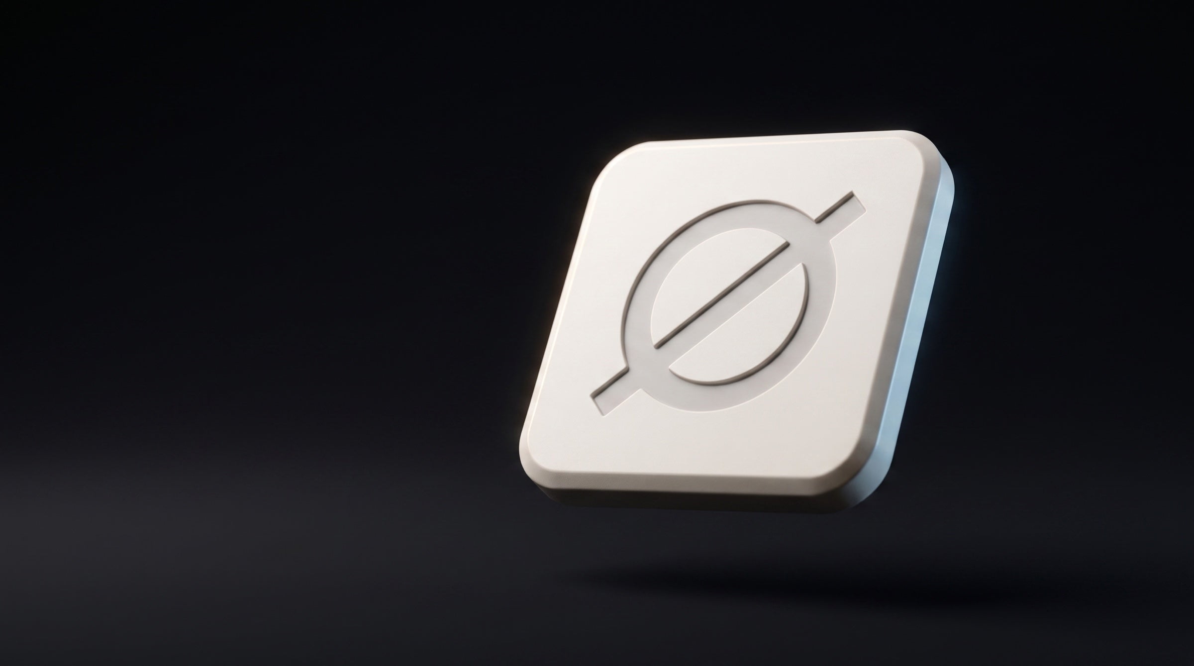 Null Tag in bone-white matte polymer, engraved Ø mark catching a rim light